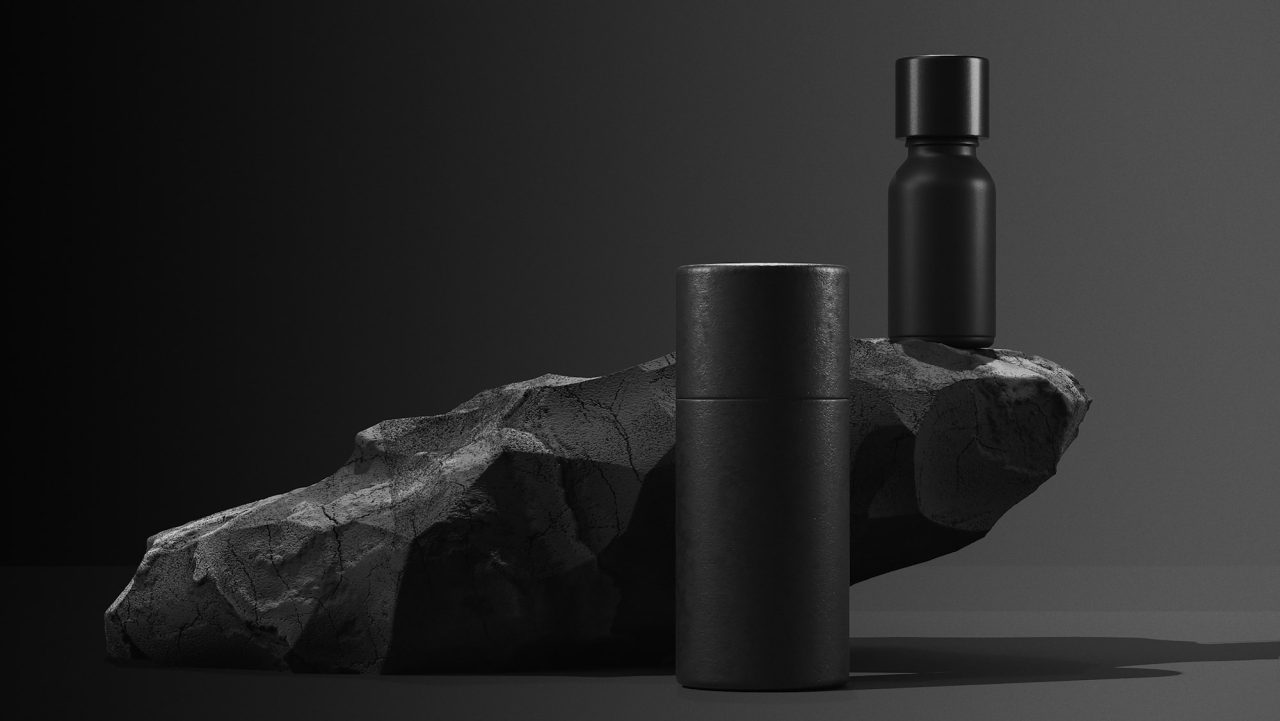bottle of essential massage oil on stone beauty treatment minimal black design packaging mock up
